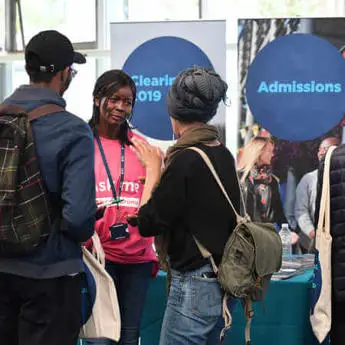 Prospective students talking to admissions adviser during Open Day