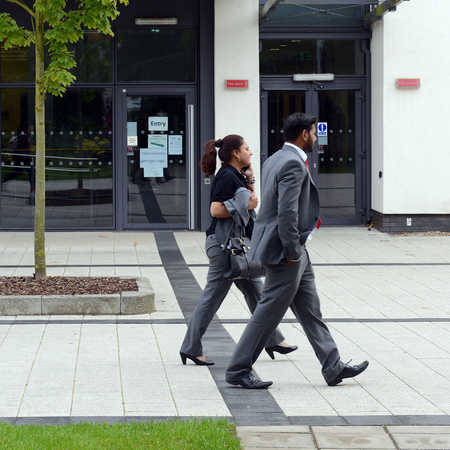 two students walking past business centre
