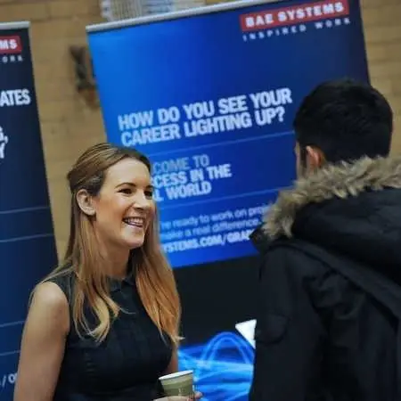 a-student-at-a-careers-fair-talking-to-an-advisor