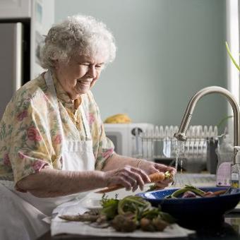 old lady washing dishes