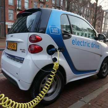 electric car charging by the road
