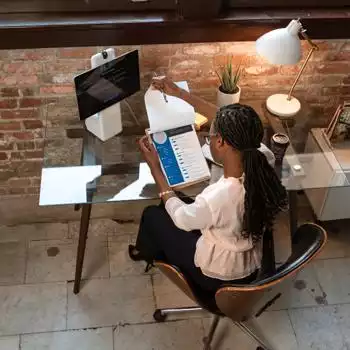 black woman entrepreneur reading documents