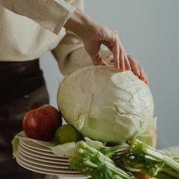 woman peeling vegetables