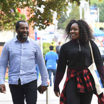 Parents of prospective students walking across campus during a Open Day