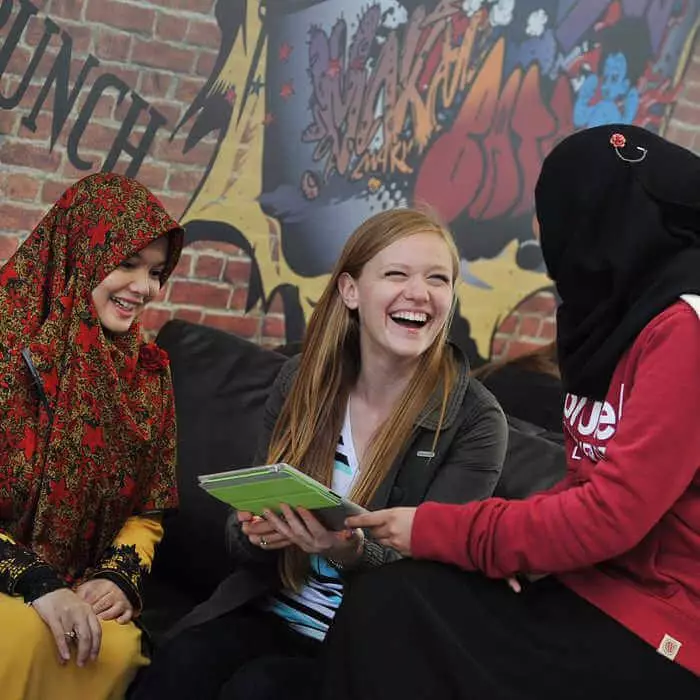 female students chatting and laughing