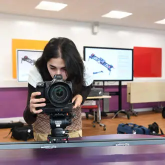Film Studies student with camera